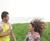 Get 100&#39;s of FREE Video Templates, Music, Footage and More at Motion Array: https://www.bit.ly/2UymF81nnnnGet this here: https://motionarray.com/stock-video/teen-couple-fly-kite-146161nnThis video shows a young teenage couple running downhill with a kite. The boy is wearing a yellow tee and short sleeve button-up shirt. The girl has on a sweet floral dress. The pair run down the grassy hill hand in hand. The girl holds the string tether up to keep the kite flying high. The two look back and fort