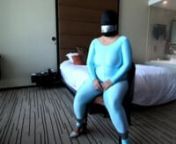 Miss M from http://wetlookfashion.com is tied up in her shiny blue spandex catsuit. Tape-gagged and bound she is unable to resist. Full version available on http://wetlookfashion.com