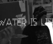 Download the song below:nhttps://nmwaterislife.bandcamp.com/track/water-is-lifennSong Title: Water Is LifennSong Artists: Innastate, Native Roots, Joy Harjo, Def-InnLyrics:nnJoy Harjo Intro: nThose who saw into the future predicted the destruction nIf we didn’t listen. nThe earth began crying out for us to stand up. nDefend the water. nStand up! nnShkeme Verse: nI took a trip up to Standing Rock nI tell you it was a big shock nTo find my people in distress nOh my gosh what a mess nPolice in fu