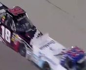While passing a lap car, Ron Hornaday gets loose and slides up into Kyle Busch.