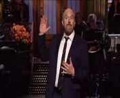 Host Louis C.K. calls out chickens for being racist and wonders if giraffes are amazed by their long necks.