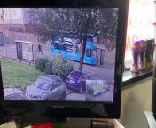 This security camera caught footage of a person crashing their bike into a bus ahead. The rider appeared to be riding their bike at high speeds on the road, paying no attention to the bus parked ahead, and slammed head on with it. Luckily, they escaped unscathed from the incident.