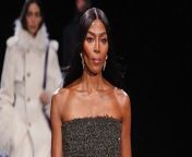 Naomi Campbell made a surprise appearance and walked the runway at Burberry’s 2024 winter London Fashion Week show.The British supermodel, 53, who has modelled for the luxury British fashion house throughout her career, wore a charcoal grey strapless maxi dress, with beaded tassel fringing that made it sparkle.She wore her hair in its signature style – bone straight, very long, and parted down the middle.Other famous faces from across sport, fashion and entertainment were also in attendance – including British-Nigerian rapper Skepta, Vogue editor-in-chief Anna Wintour, supermodel Jourdan Dunn and long-distance runner Mo Farah.