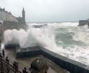 Dramatic footage shows Storm Kathleen battering a Cornish town yesterday as a parked car gets a soaking.