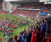 Dundee United fans invade the pitch after the 1-0 win over Ayr United that has unofficially secured the Scottish Championship title.