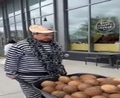 PETA protesters smash coconuts in front of the East Liberty Whole Foods, protesting the sale of some of the products they sell